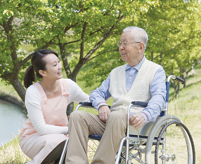 woman with man in wheelchair