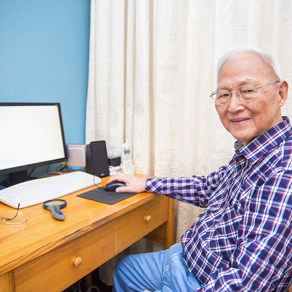 Elderly man using computer