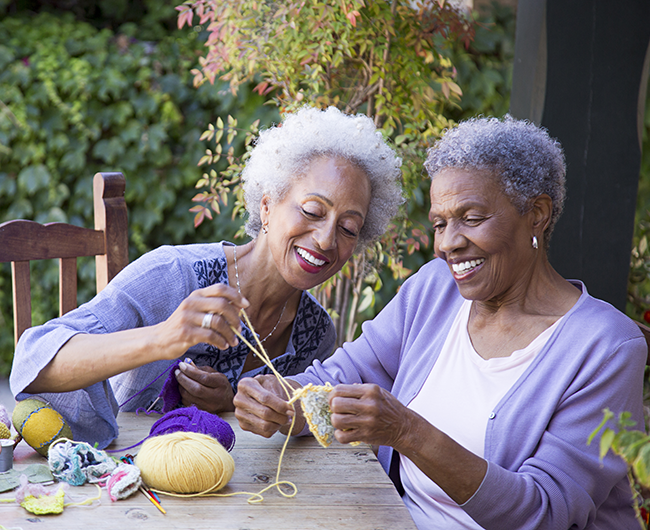 two friends crocheting