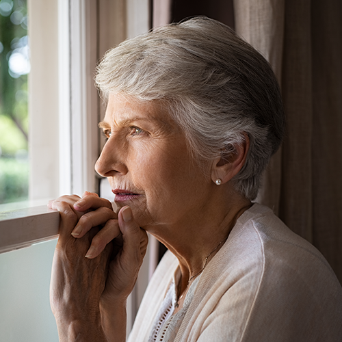 woman looking out window