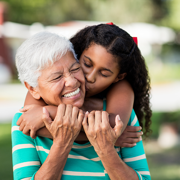 grandma and granddaughter hugging