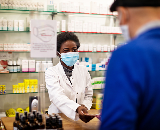 pharmacist helping a customer