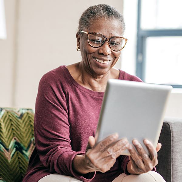 woman looking at tablet