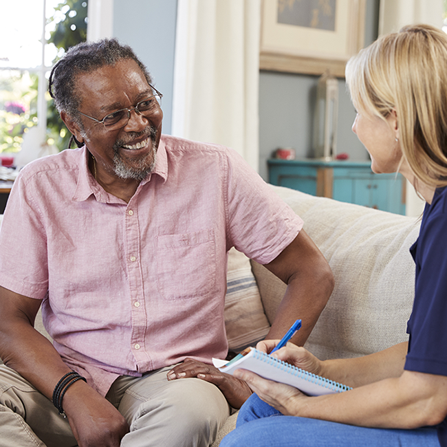 man talking to health care provider